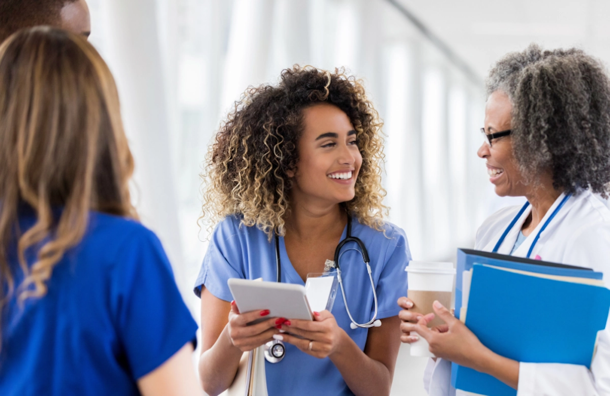 Happy healthcare employees talking